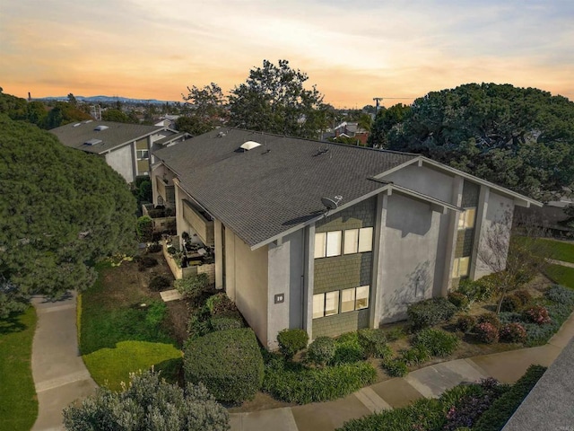 8566 Van Ness Ct Unit 19G, Huntington Beach, CA 92646 - view of front of property with stucco siding and roof with shingles
