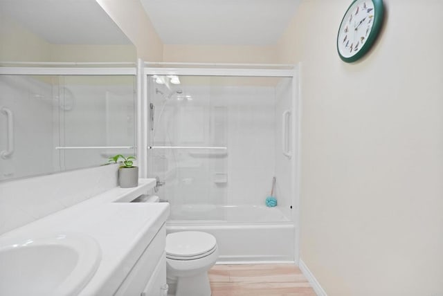 8566 Van Ness Ct Unit 19G, Huntington Beach, CA 92646 - full bath with vanity, wood finished floors, and combined bath / shower with glass door