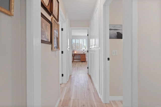 8566 Van Ness Ct Unit 19G, Huntington Beach, CA 92646 - corridor featuring light wood-type flooring and baseboards