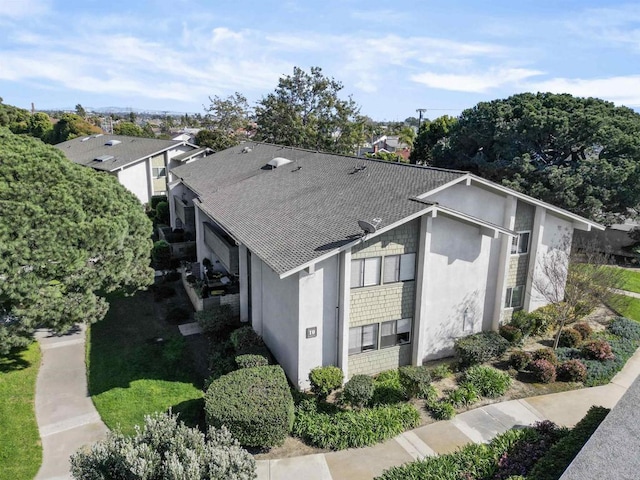 8566 Van Ness Ct Unit 19G, Huntington Beach, CA 92646 - view of side of property featuring a shingled roof