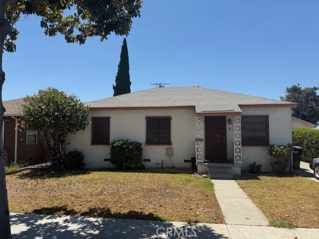 14319 Devlin Ave, Norwalk, CA 90650 - view of front facade featuring a front yard and stucco siding
