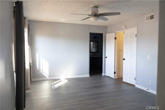 3223 Algonquin Ln, Riverside, CA 92503 - unfurnished bedroom featuring dark wood-style floors, a textured ceiling, and ceiling fan
