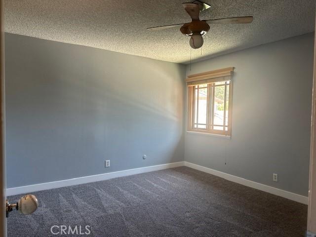 3223 Algonquin Ln, Riverside, CA 92503 - spare room with a textured ceiling, a ceiling fan, and carpet floors