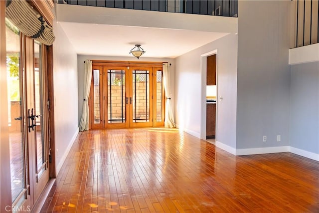3223 Algonquin Ln, Riverside, CA 92503 - empty room with french doors and wood-type flooring