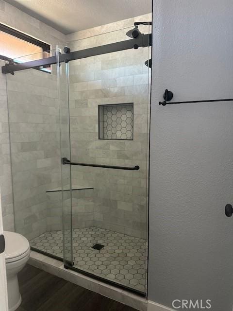 3223 Algonquin Ln, Riverside, CA 92503 - bathroom with wood finished floors and a shower stall