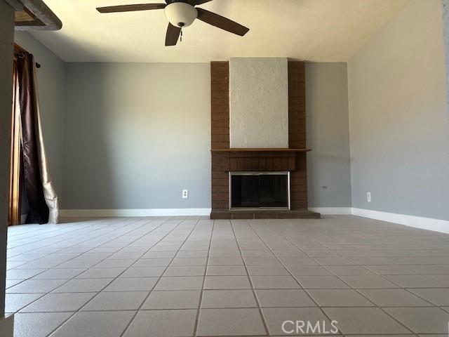 3223 Algonquin Ln, Riverside, CA 92503 - unfurnished living room featuring light tile patterned floors and ceiling fan