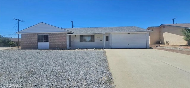 28218 W Worcester Rd, Menifee, CA 92586 - ranch-style house with driveway, a garage, and brick siding