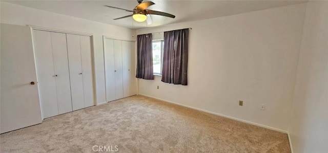 28218 W Worcester Rd, Menifee, CA 92586 - unfurnished bedroom with carpet flooring, two closets, and a ceiling fan