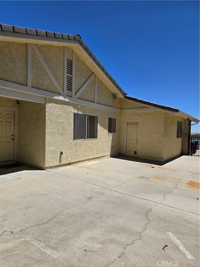 41653 62nd St W, Palmdale, CA 93551 - back of house featuring stucco siding and a patio