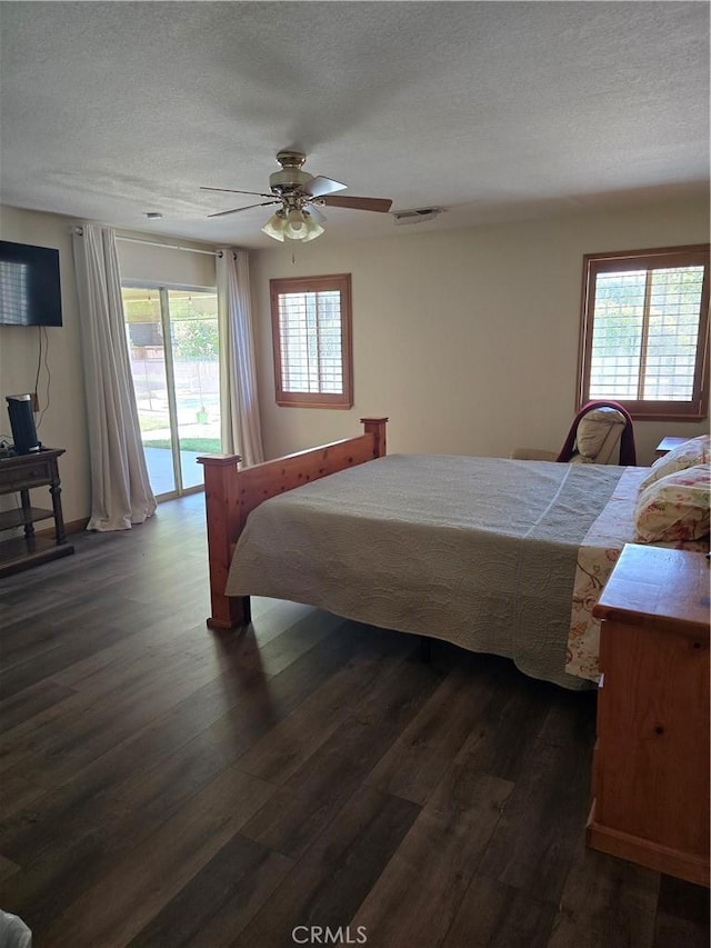 41653 62nd St W, Palmdale, CA 93551 - bedroom with access to outside, dark wood-style flooring, a textured ceiling, and ceiling fan