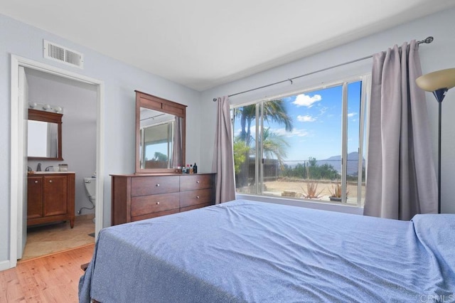 7549 Goode St, San Diego, CA 92139 - bedroom with light wood finished floors, a mountain view, and ensuite bathroom