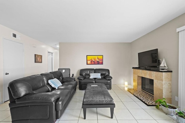 7549 Goode St, San Diego, CA 92139 - living room with light tile patterned flooring and a tile fireplace