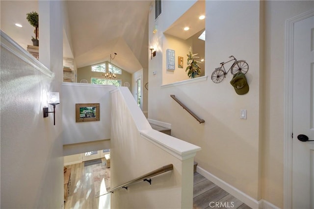 6362 Coffeeberry Ct, Avila Beach, CA 93424 - staircase with a chandelier, wood finished floors, vaulted ceiling, and recessed lighting