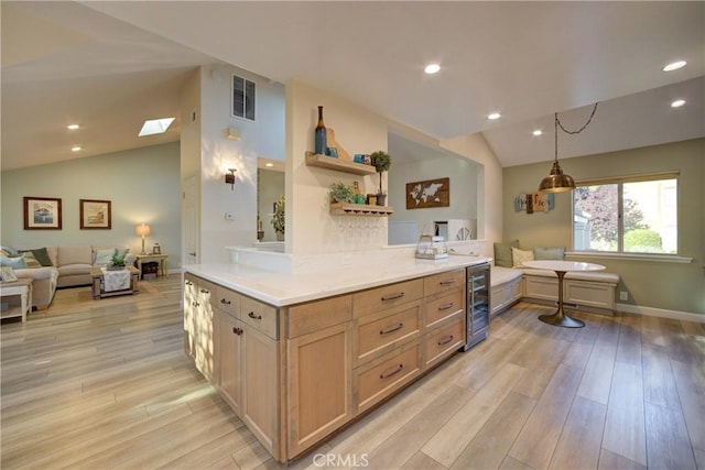 6362 Coffeeberry Ct, Avila Beach, CA 93424 - kitchen with lofted ceiling, wine cooler, open floor plan, light wood-style floors, and open shelves