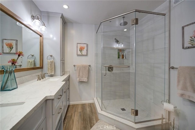 6362 Coffeeberry Ct, Avila Beach, CA 93424 - full bathroom featuring wood finished floors, double vanity, a shower stall, and recessed lighting