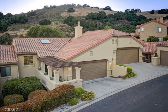 6362 Coffeeberry Ct, Avila Beach, CA 93424 - mediterranean / spanish-style house featuring a tile roof, a chimney, and stucco siding