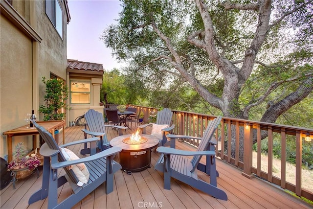 6362 Coffeeberry Ct, Avila Beach, CA 93424 - wooden deck with a fire pit and outdoor dining area