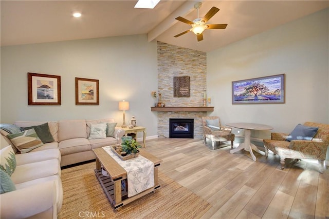 6362 Coffeeberry Ct, Avila Beach, CA 93424 - living area with wood finished floors, ceiling fan, beamed ceiling, a stone fireplace, and high vaulted ceiling