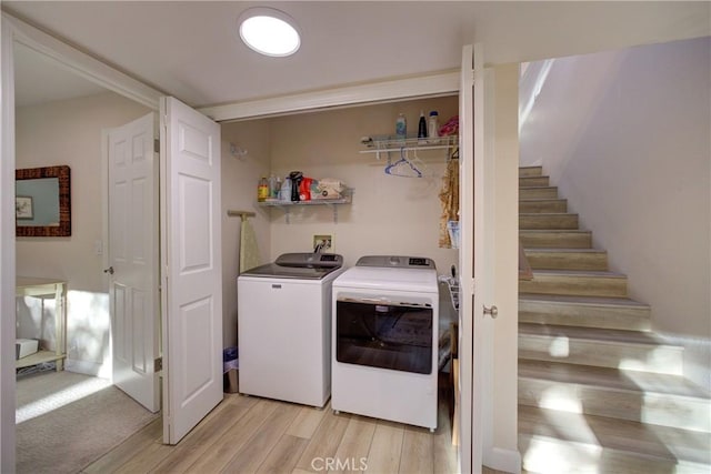 6362 Coffeeberry Ct, Avila Beach, CA 93424 - laundry area with washing machine and dryer and light wood-style floors