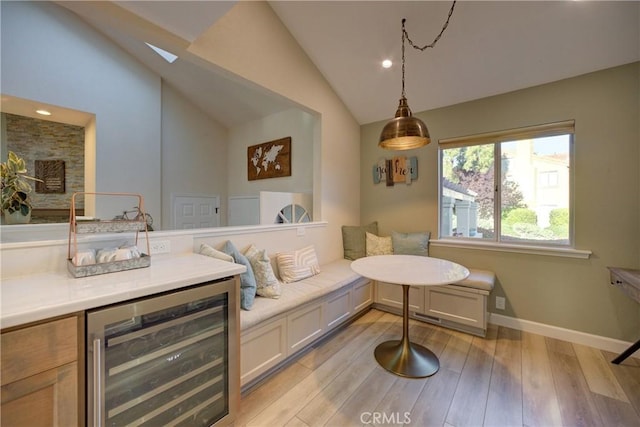 6362 Coffeeberry Ct, Avila Beach, CA 93424 - living area with beverage cooler, lofted ceiling, light wood-type flooring, a skylight, and recessed lighting