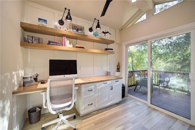 6362 Coffeeberry Ct, Avila Beach, CA 93424 - home office featuring built in study area, light wood-style floors, healthy amount of natural light, beam ceiling, and high vaulted ceiling