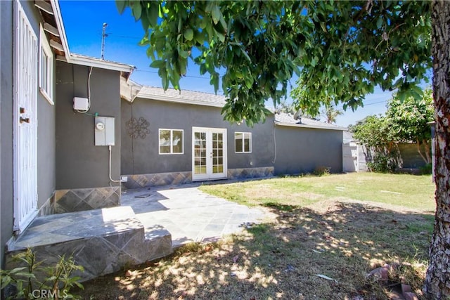 5609 Clark Ave, Lakewood, CA 90712 - rear view of property with french doors, a patio, a yard, and stucco siding