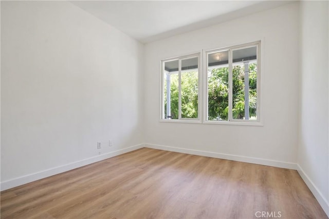 5609 Clark Ave, Lakewood, CA 90712 - spare room featuring baseboards and light wood-style flooring