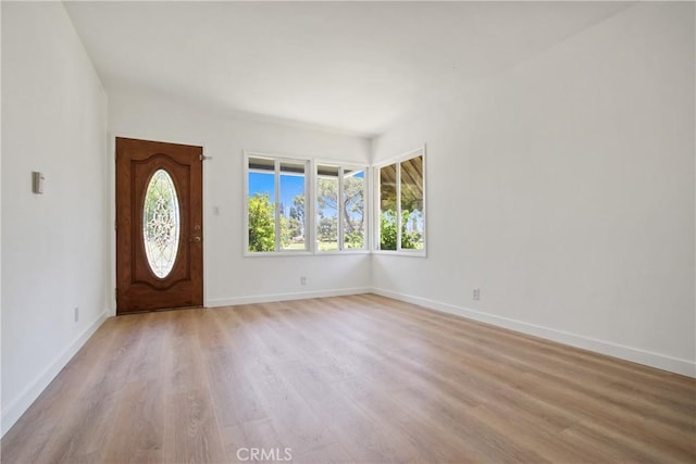 5609 Clark Ave, Lakewood, CA 90712 - foyer with light wood-style flooring and baseboards