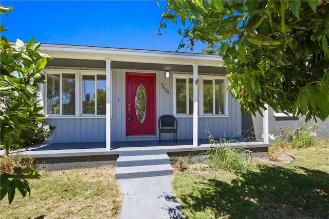 5609 Clark Ave, Lakewood, CA 90712 - view of exterior entry featuring a porch and board and batten siding
