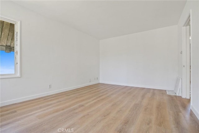 5609 Clark Ave, Lakewood, CA 90712 - unfurnished room with light wood-style flooring and baseboards