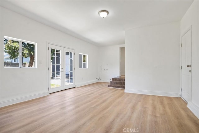 5609 Clark Ave, Lakewood, CA 90712 - unfurnished living room with french doors and light wood-style floors