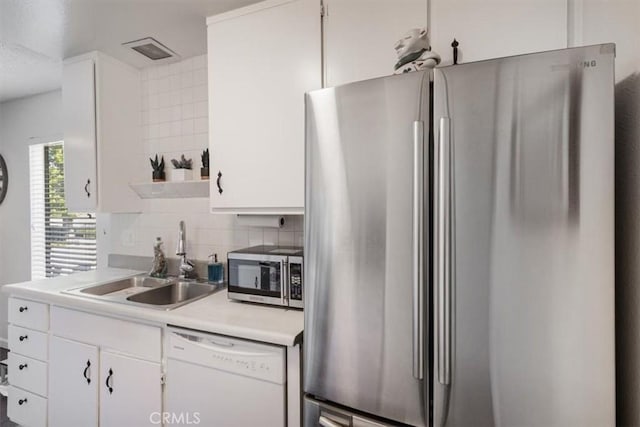 1490 Cabrillo Park Dr Unit B, Santa Ana, CA 92701 - kitchen with stainless steel appliances, light countertops, white cabinets, decorative backsplash, and open shelves