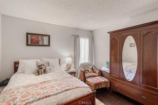 1490 Cabrillo Park Dr Unit B, Santa Ana, CA 92701 - bedroom with dark wood-type flooring and a textured ceiling