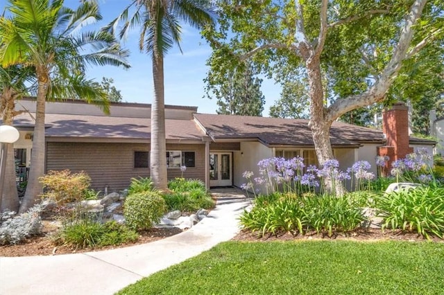 1490 Cabrillo Park Dr Unit B, Santa Ana, CA 92701 - view of front facade featuring french doors and a shingled roof
