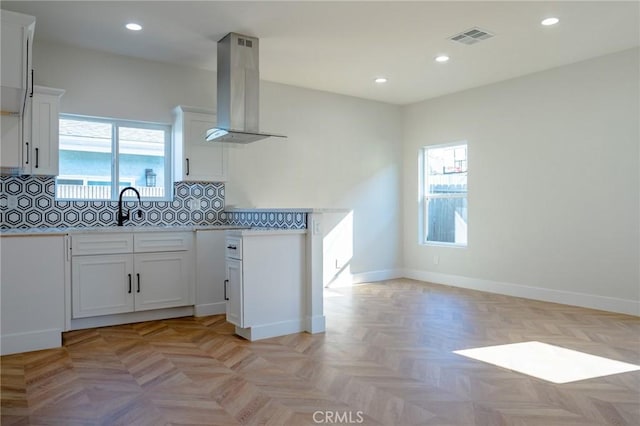 5916 Walnut Ave, Long Beach, CA 90805 - kitchen with extractor fan, plenty of natural light, recessed lighting, decorative backsplash, and white cabinetry
