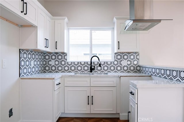 5916 Walnut Ave, Long Beach, CA 90805 - kitchen with extractor fan, backsplash, light countertops, and white cabinetry