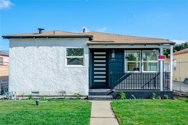 5916 Walnut Ave, Long Beach, CA 90805 - bungalow-style house featuring a front lawn, stucco siding, and covered porch