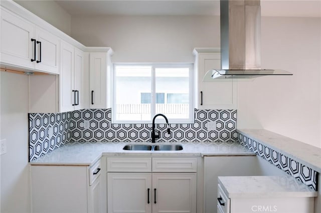 5916 Walnut Ave, Long Beach, CA 90805 - kitchen featuring ventilation hood, backsplash, light countertops, and white cabinets
