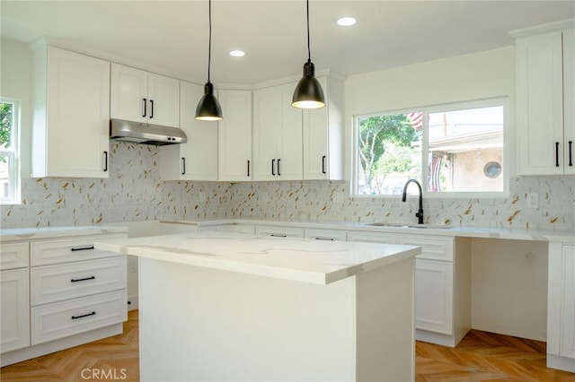 5916 Walnut Ave, Long Beach, CA 90805 - kitchen with under cabinet range hood, recessed lighting, backsplash, and light stone countertops