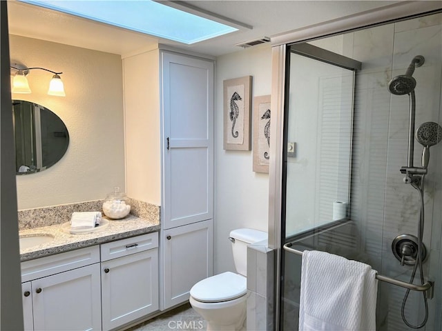 13310 N Fairfield Ln Unit M7 176L, Seal Beach, CA 90740 - bathroom with vanity, a shower stall, and a skylight