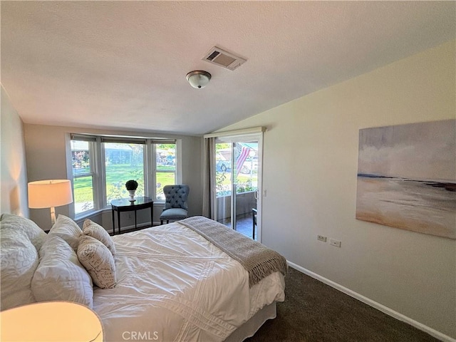 13310 N Fairfield Ln Unit M7 176L, Seal Beach, CA 90740 - carpeted bedroom featuring access to exterior, lofted ceiling, multiple windows, and a textured ceiling