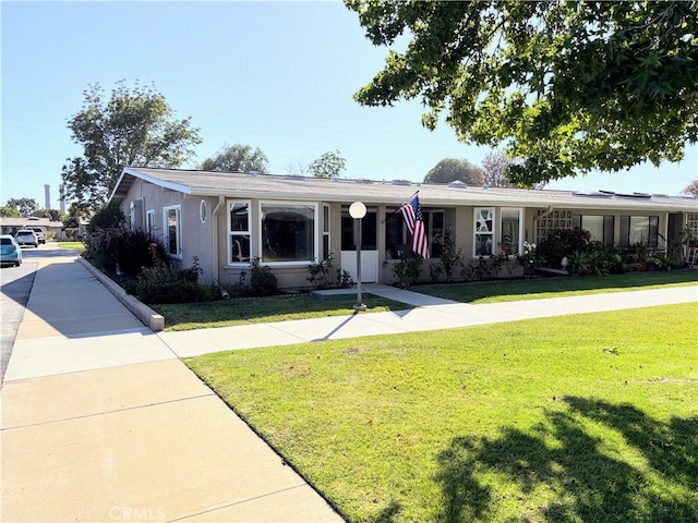 13310 N Fairfield Ln Unit M7 176L, Seal Beach, CA 90740 - ranch-style house featuring a front yard