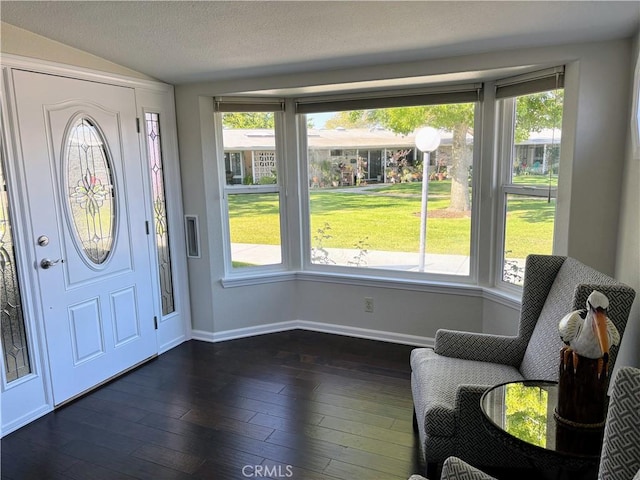 13310 N Fairfield Ln Unit M7 176L, Seal Beach, CA 90740 - foyer with healthy amount of natural light, vaulted ceiling, and dark wood-style flooring