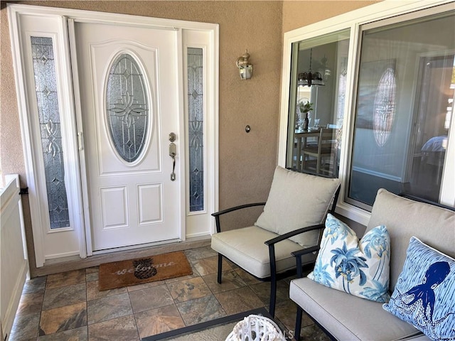 13310 N Fairfield Ln Unit M7 176L, Seal Beach, CA 90740 - doorway to property with stucco siding and a porch