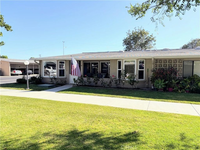 13310 N Fairfield Ln Unit M7 176L, Seal Beach, CA 90740 - ranch-style house with a front lawn and stucco siding