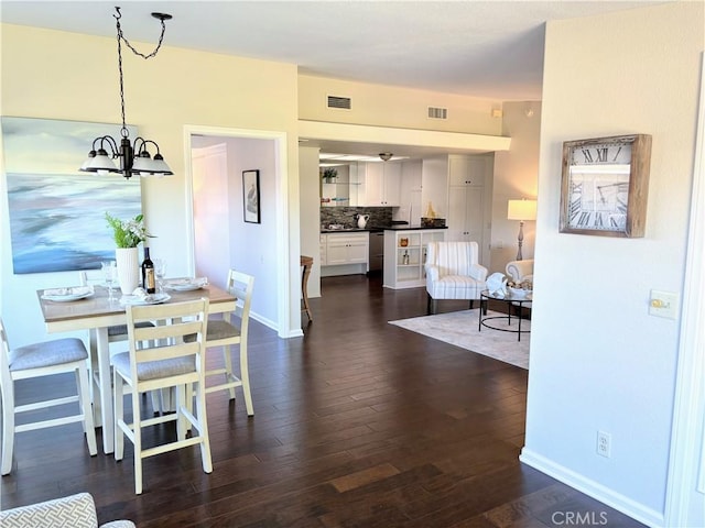13310 N Fairfield Ln Unit M7 176L, Seal Beach, CA 90740 - dining space featuring dark wood-style floors and a chandelier