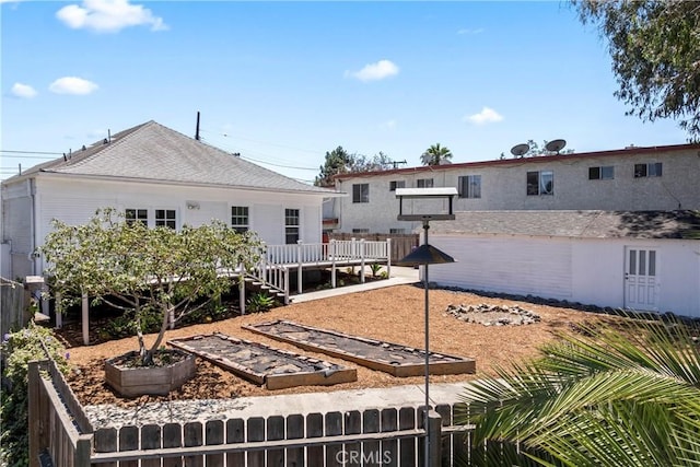 976 N Loma Vista Dr, Long Beach, CA 90813 - rear view of property featuring a vegetable garden and a deck