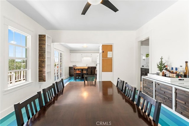 976 N Loma Vista Dr, Long Beach, CA 90813 - dining room featuring a ceiling fan, plenty of natural light, and wood finished floors
