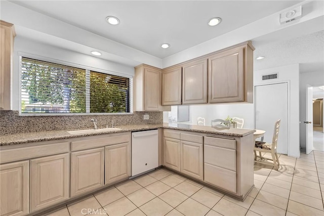 10020 Wystone Ave, Northridge, CA 91324 - kitchen with white dishwasher, light brown cabinetry, light tile patterned floors, tasteful backsplash, and recessed lighting