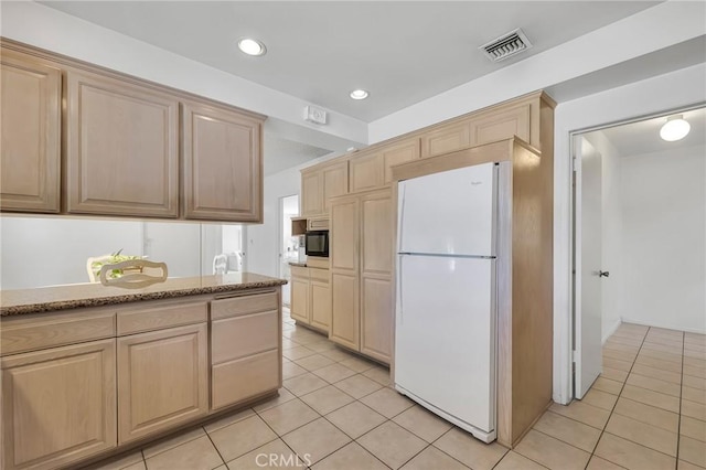 10020 Wystone Ave, Northridge, CA 91324 - kitchen featuring freestanding refrigerator, light brown cabinetry, light tile patterned floors, and recessed lighting